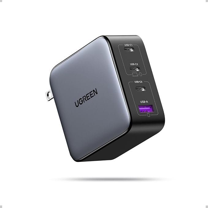 UGREEN Nexode 65W GaN fast charger plugged into desk setup